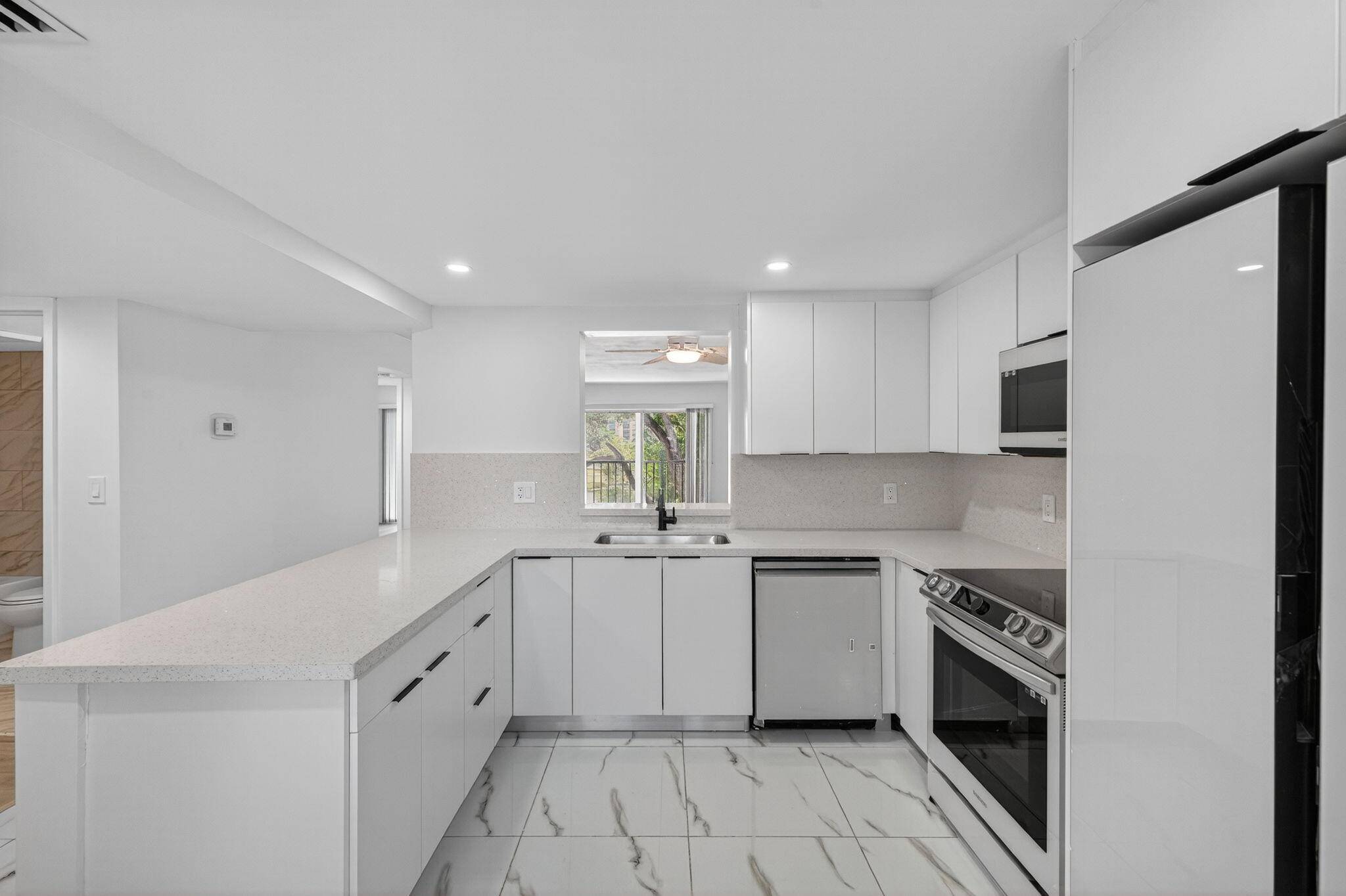 Welcome to this fully remodeled condo w stunning lake views in the vibrant 55 community of Huntington Lakes !