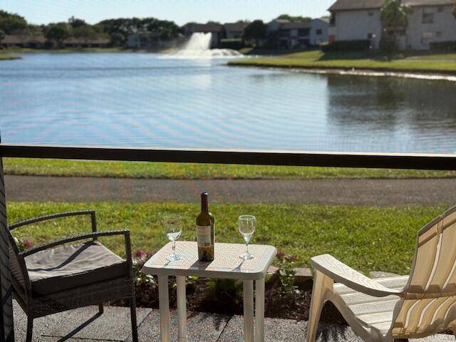 Spectacular lake fountain view, Spacious 2 2, all ages gated community next to Multi Million Lotus Palm.
