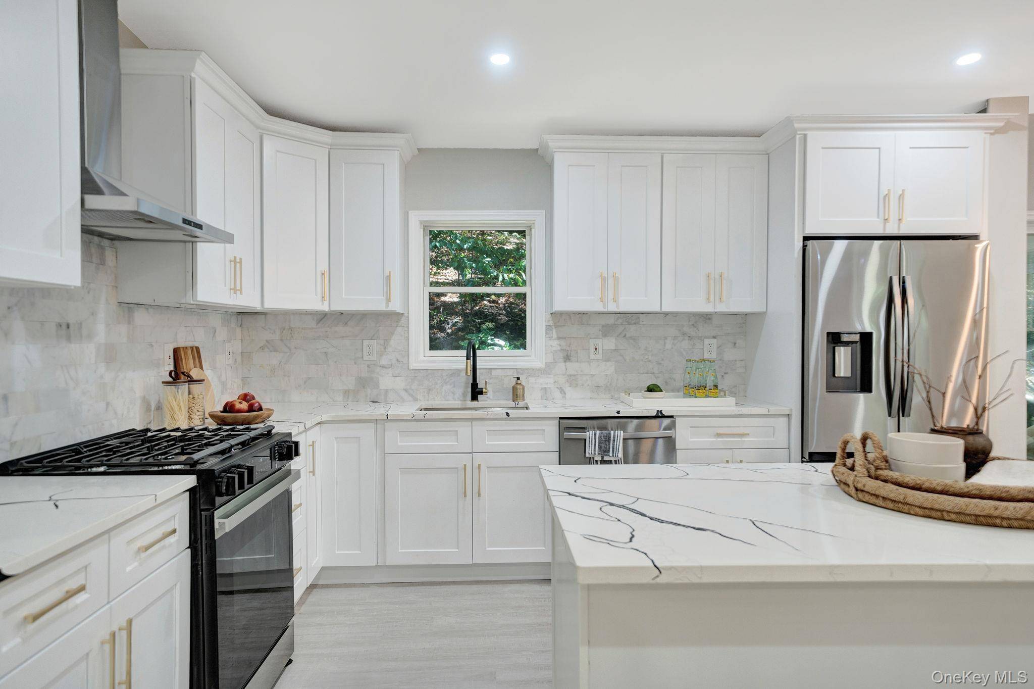 Welcome to this beautifully remodeled 4 bedroom, 4 bath colonial in Northport.