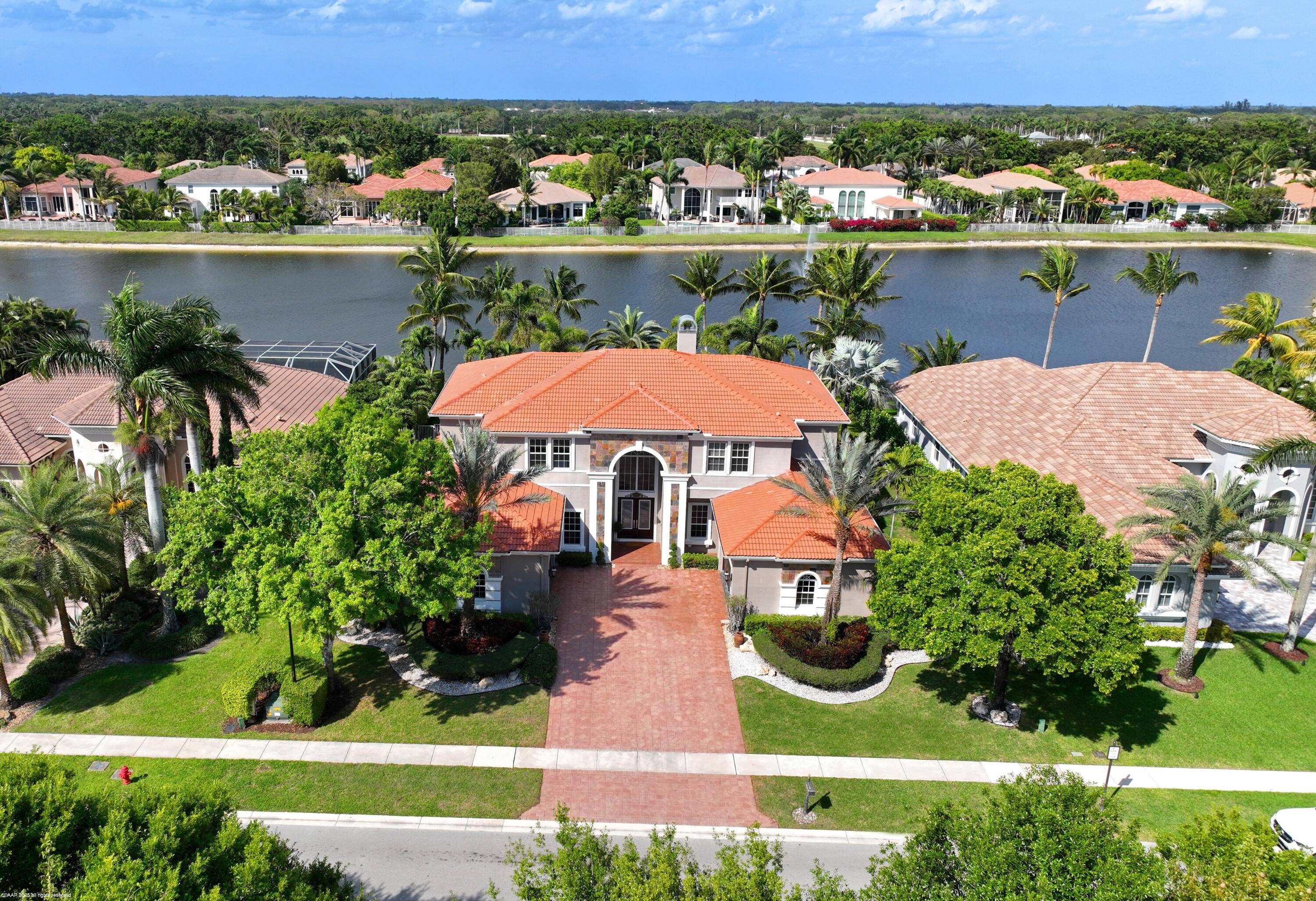 Stunning 5 bedroom lakefront home in Wellington's gated Equestrian Club !