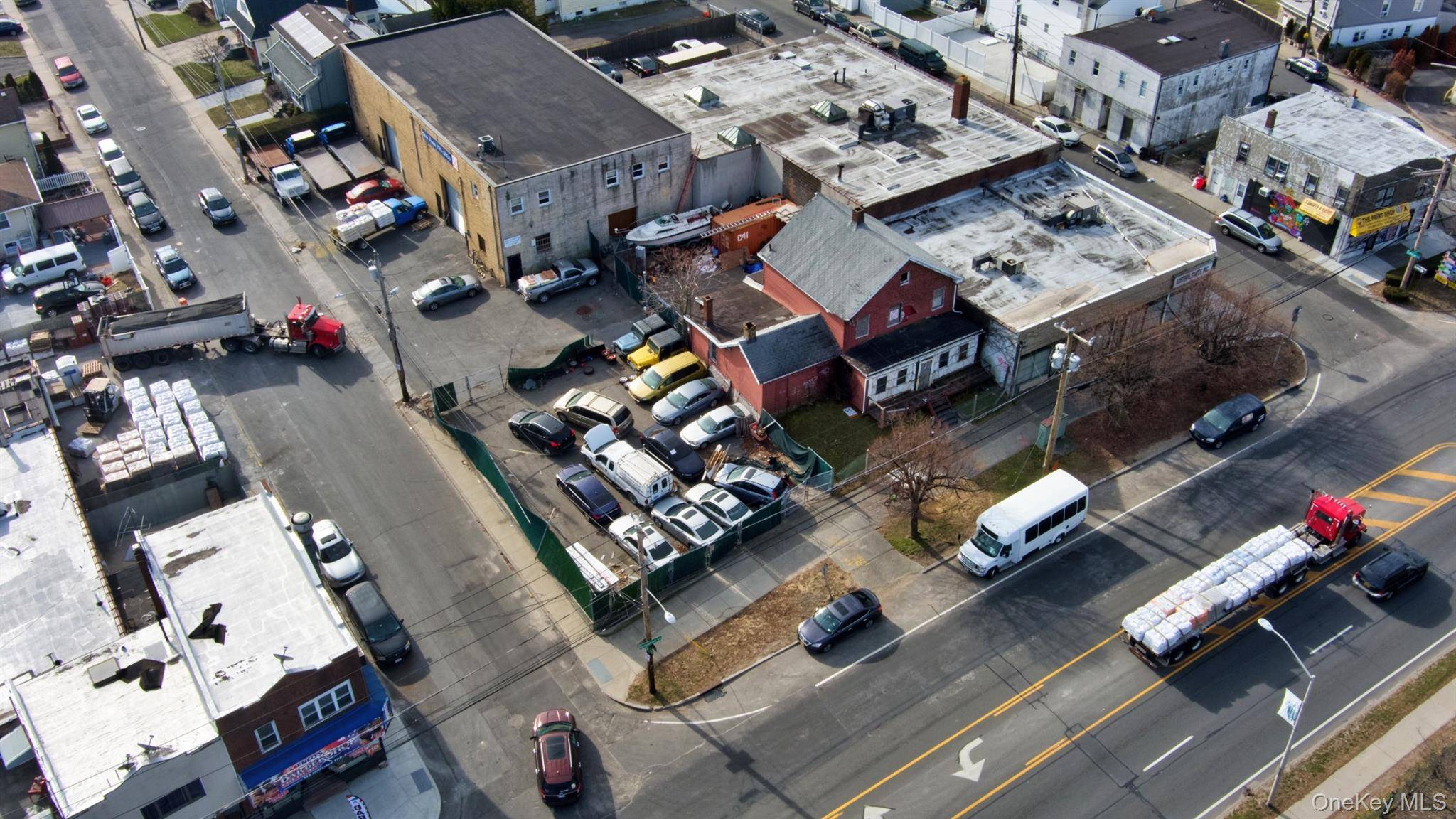 Presenting a rare opportunity to acquire a prime commercial lot at 351 Hempstead Turnpike in the thriving community of Elmont, New York.