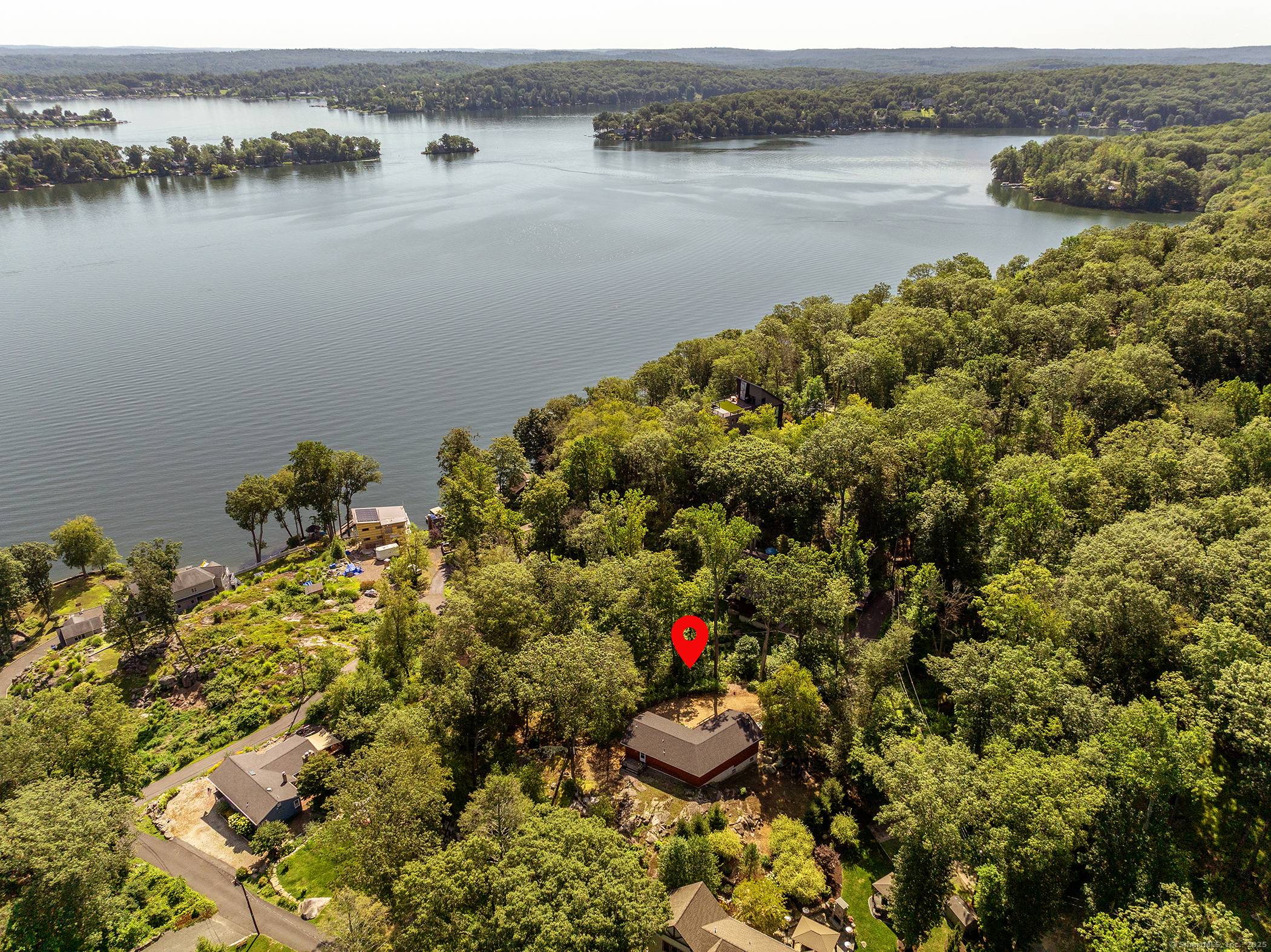Nestled in the desirable Candlewood Lake Community of Hollywyle, 1 Sylvan Road offers a rare combination of privacy, very little traffic, lake charm, beach access and a boat dock slip ...