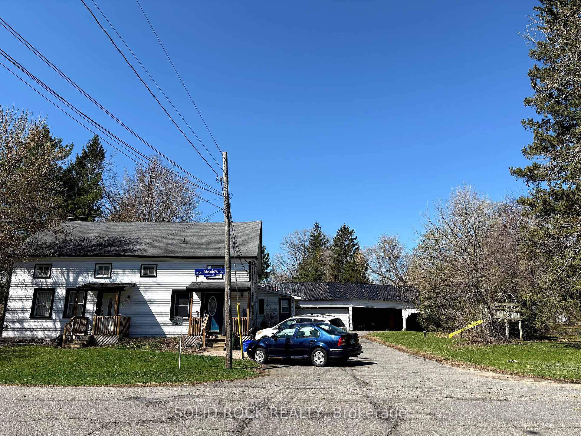 1370 1, 2 and 1380 Meadow a century side by side with a third unit.