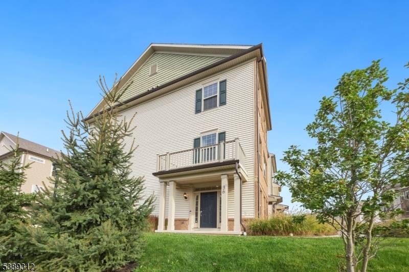 Welcome home to this contemporary, luxurious end unit townhome in the highly sought after Livingston Square community, featuring desirable southwestern exposure.