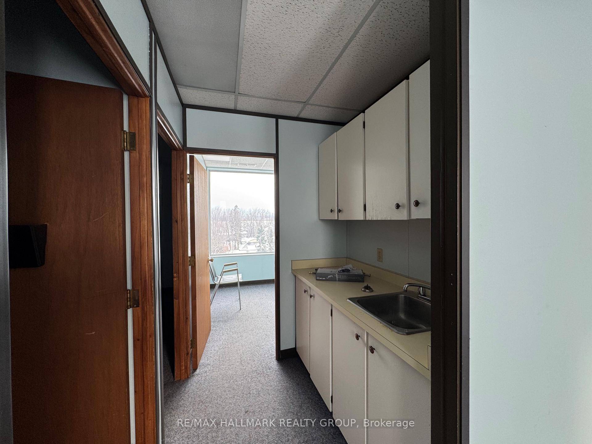 Prime office space available for lease at the bustling intersection of Carling Ave and Kempster Ave, directly across from Cineplex Cinema and Shoppers Drug Mart.