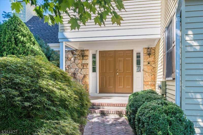 Spacious and updated three bedroom, two and one half bath end unit in desirable Liberty Greens.