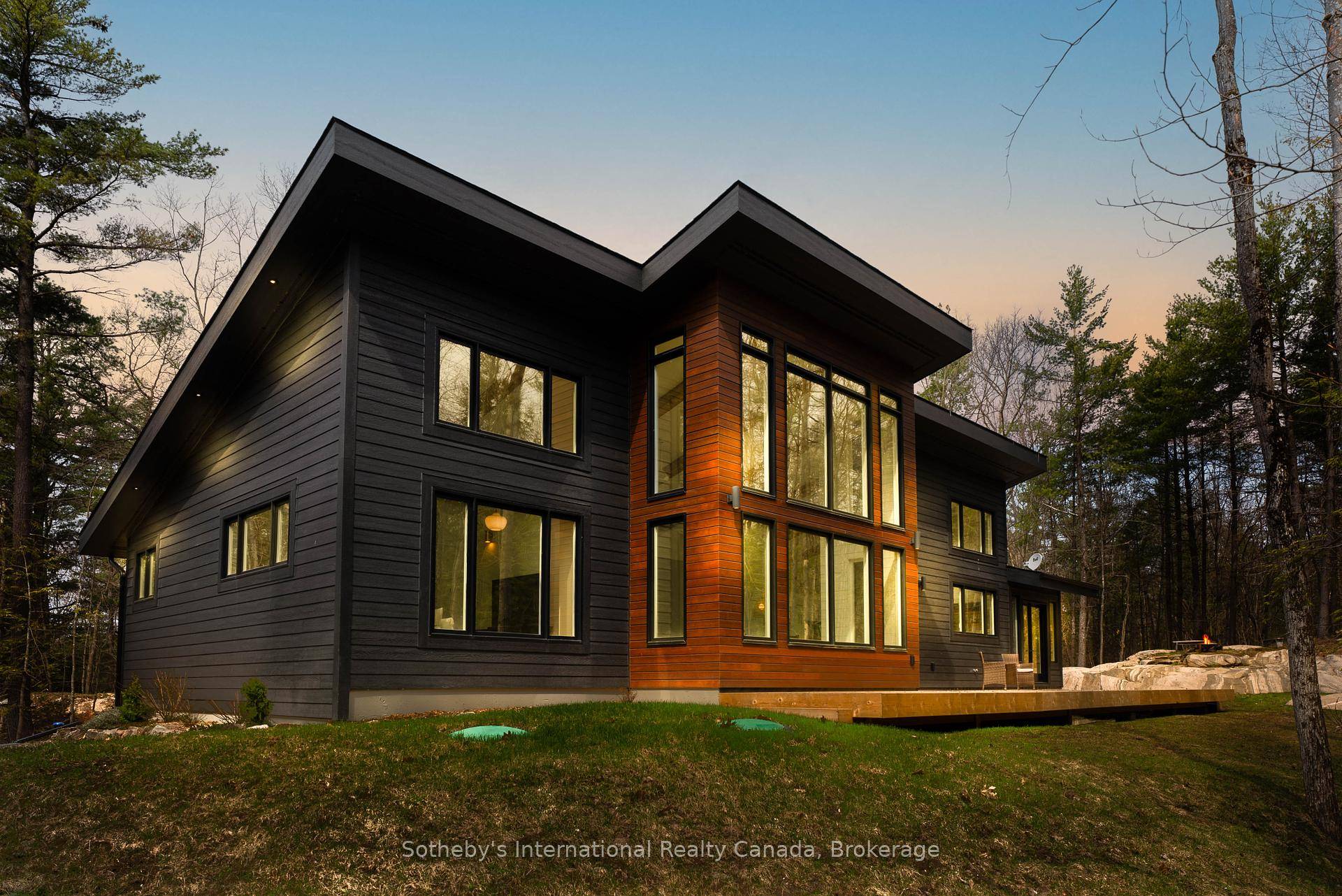 A striking contemporary home set on nearly 4 acres of private woodland in Muskoka.