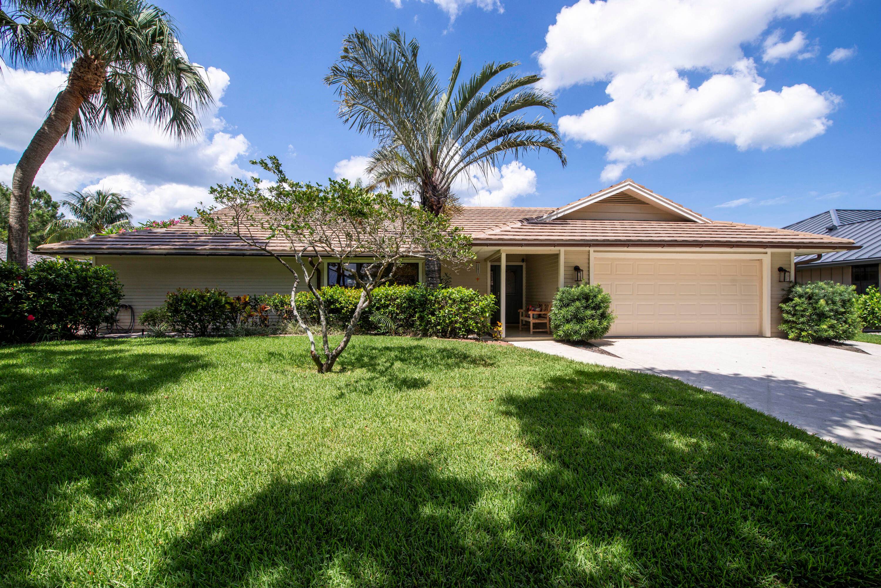 This captivating single story home nestled within the coveted community of The Shores offers serene lake and tree lined views.