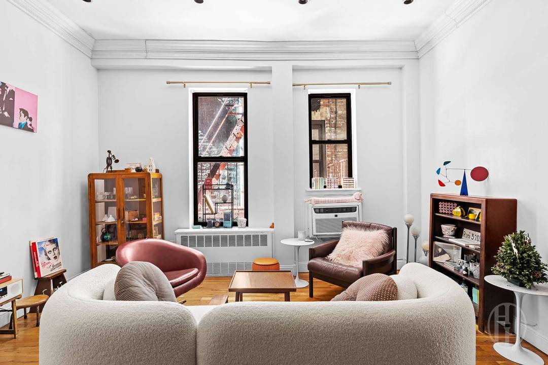 This charming two bedroom, one bathroom residence perfectly blends historic industrial character with modern style, featuring a large open living and dining area defined by a stunning floor to ceiling ...