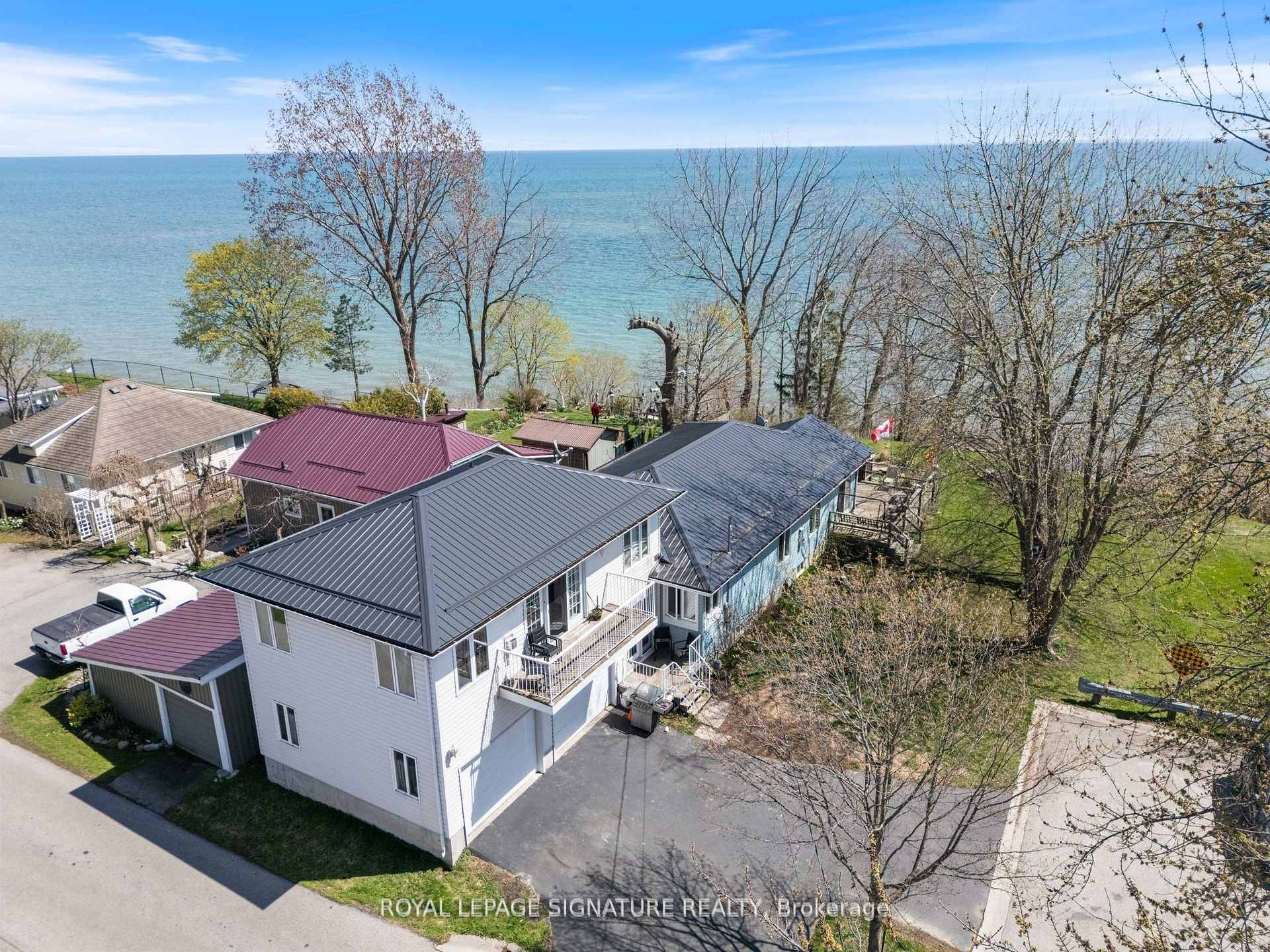 Nestled at the end of a quiet dead end street in the heart of Port Dovers picturesque lakeside community, this 1.