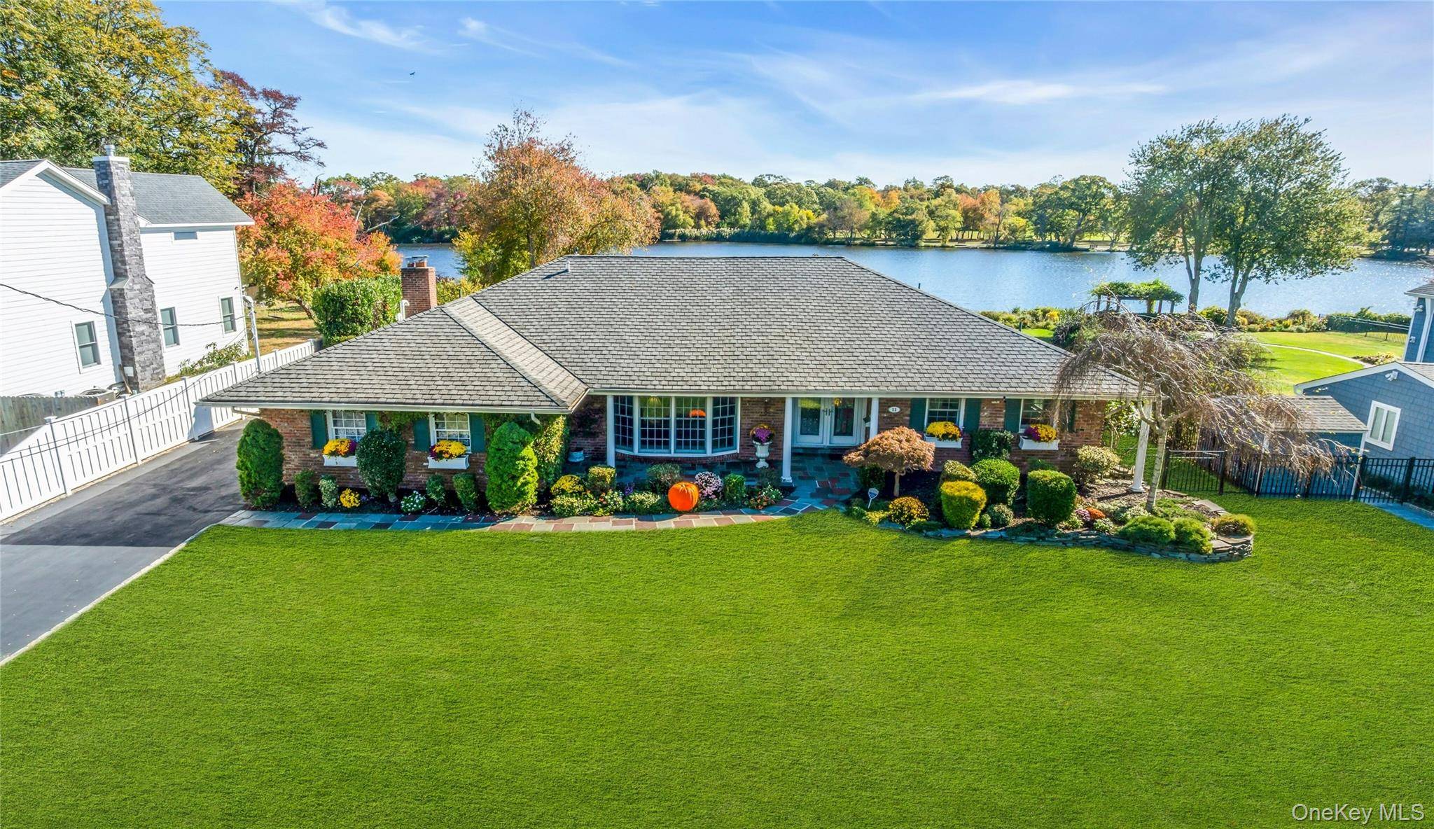 Located on Knapps Lake, this truly custom wide line brick ranch offers the perfect blend of comfort amp ; privacy with picturesque and serene views from almost every room.