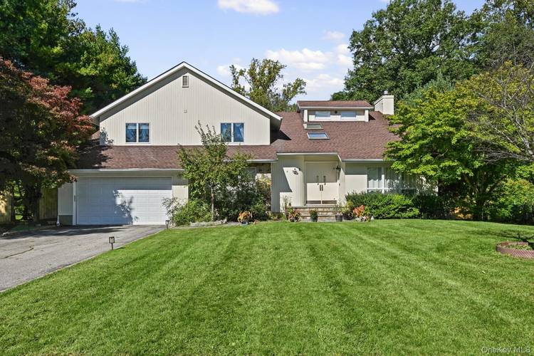 Tucked away on a quiet Glen Cove cul de sac, this 5 bedroom, 3.