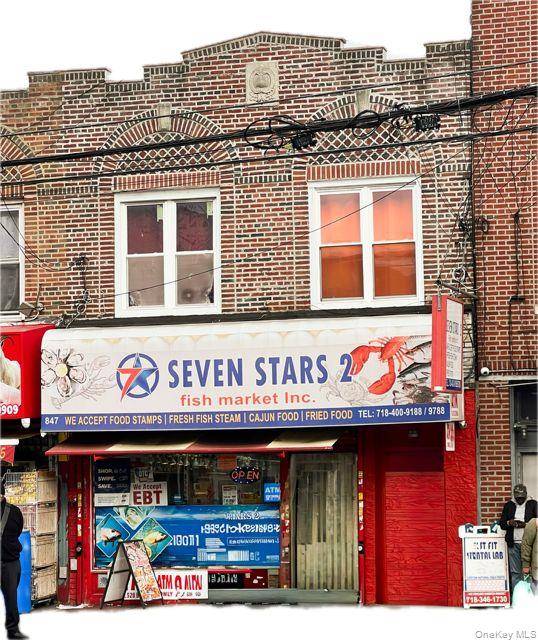 This two story mixed use building features a commercial space on the ground floor and two residential units above.