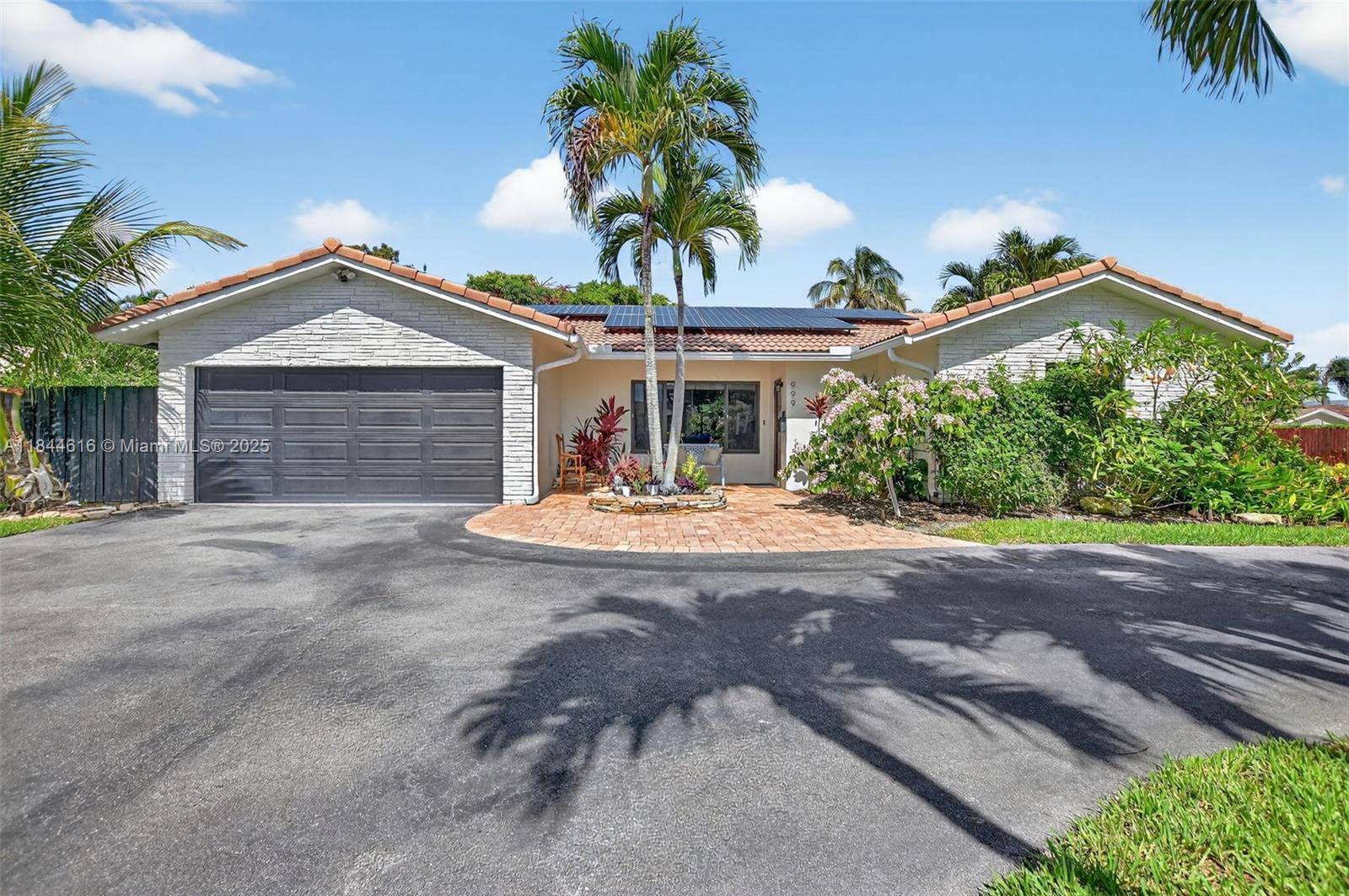Beautifully UPDATED 4BR 3 FULL BATH pool home on a spacious corner lot in East Boca's desirable Country Club Village.