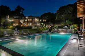 Resort style living in the privacy of backcountry Greenwich on the lake.
