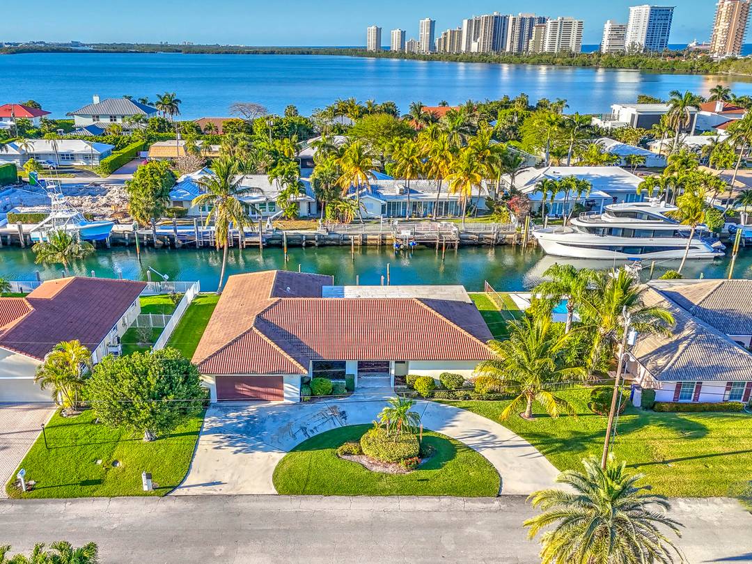 Fully Remodeled Home with 100' of waterfront with new 80' dock, new roof, new Impact windows and doors, new flooring through out home.