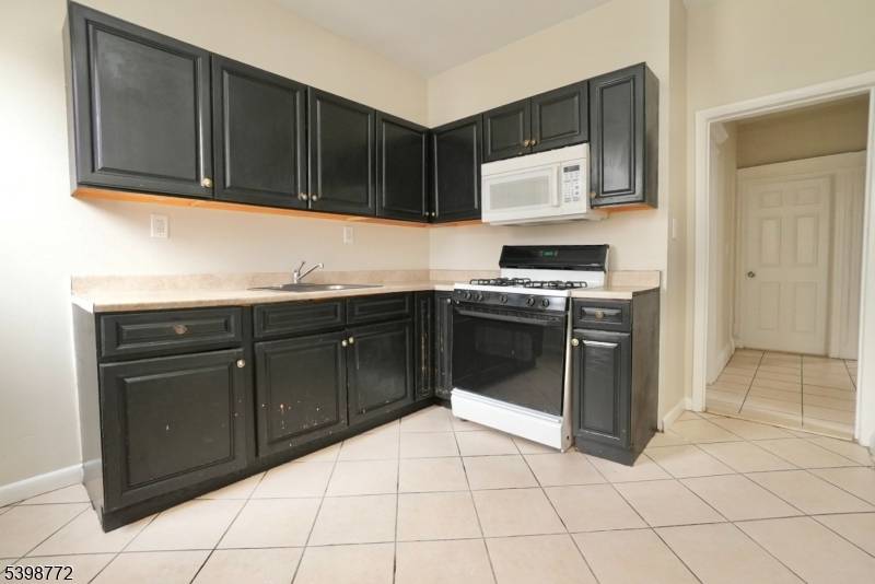 Welcome to this spacious multi family home located in the heart of East Orange.