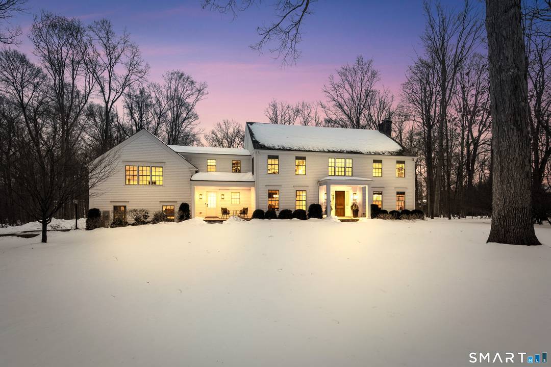 Ideally situated between the coveted town centers of Darien and New Canaan, this exceptionally and recently completely redesigned colonial rests on 2.