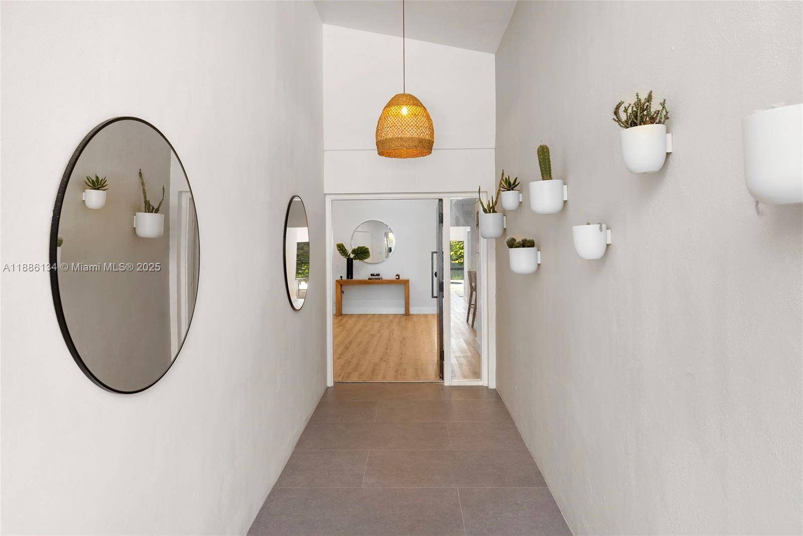 Exceptional fully renovated waterfront residence located on the exclusive gated island of Normandy Shores.