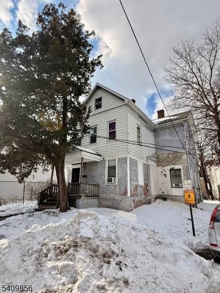 Legal 3 family home with separate utilities.