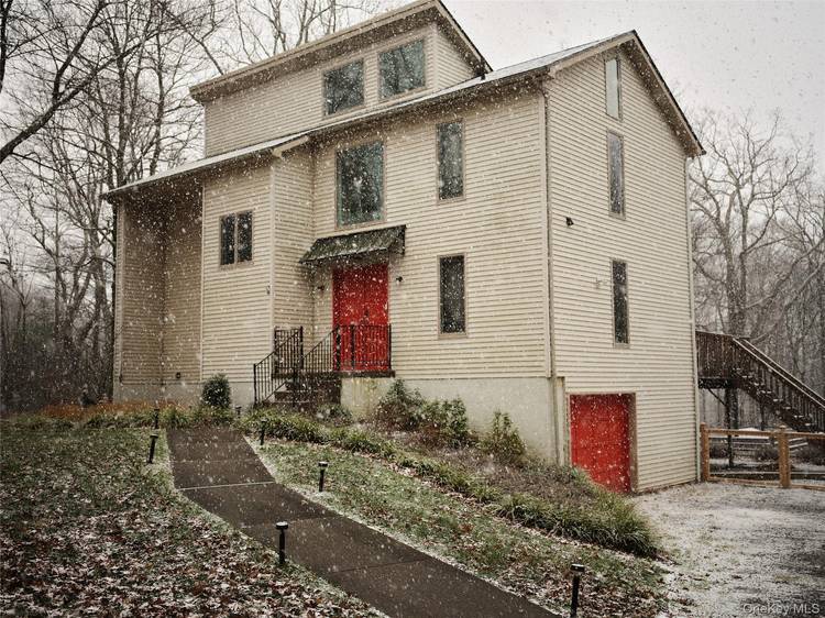Welcome to this vibrant mid century inspired retreat tucked into a quiet hamlet in the Hudson Valley.