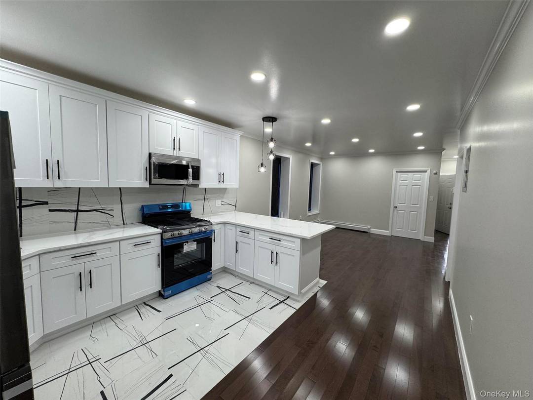 Huge Fully Renovated Legal detached 2 family with shared driveway and 2 car garage Brick House on very nice block and close to everything.