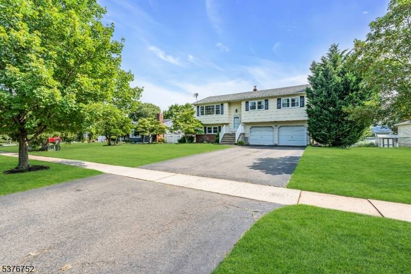 MOVE RIGHT IN to this 4 bedroom, 2 bath, split level with a two car garage in the Kendall Park section of South Brunswick.