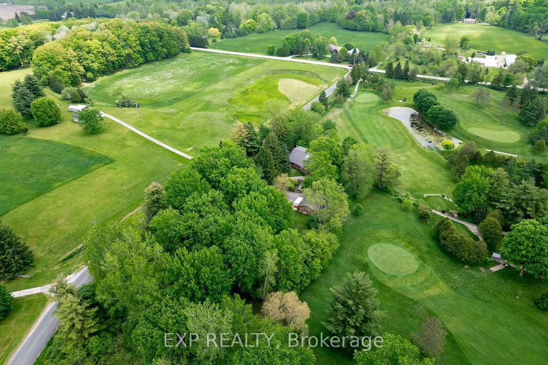 This one of a kind home boasts over 2 acres of land and stunning, year round views overlooking the golf course, offering a serene retreat just minutes from the city.