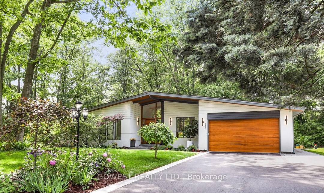 Modern luxury renovated bungalow on a massive, third of an acre pie shaped lot, backing into a park.