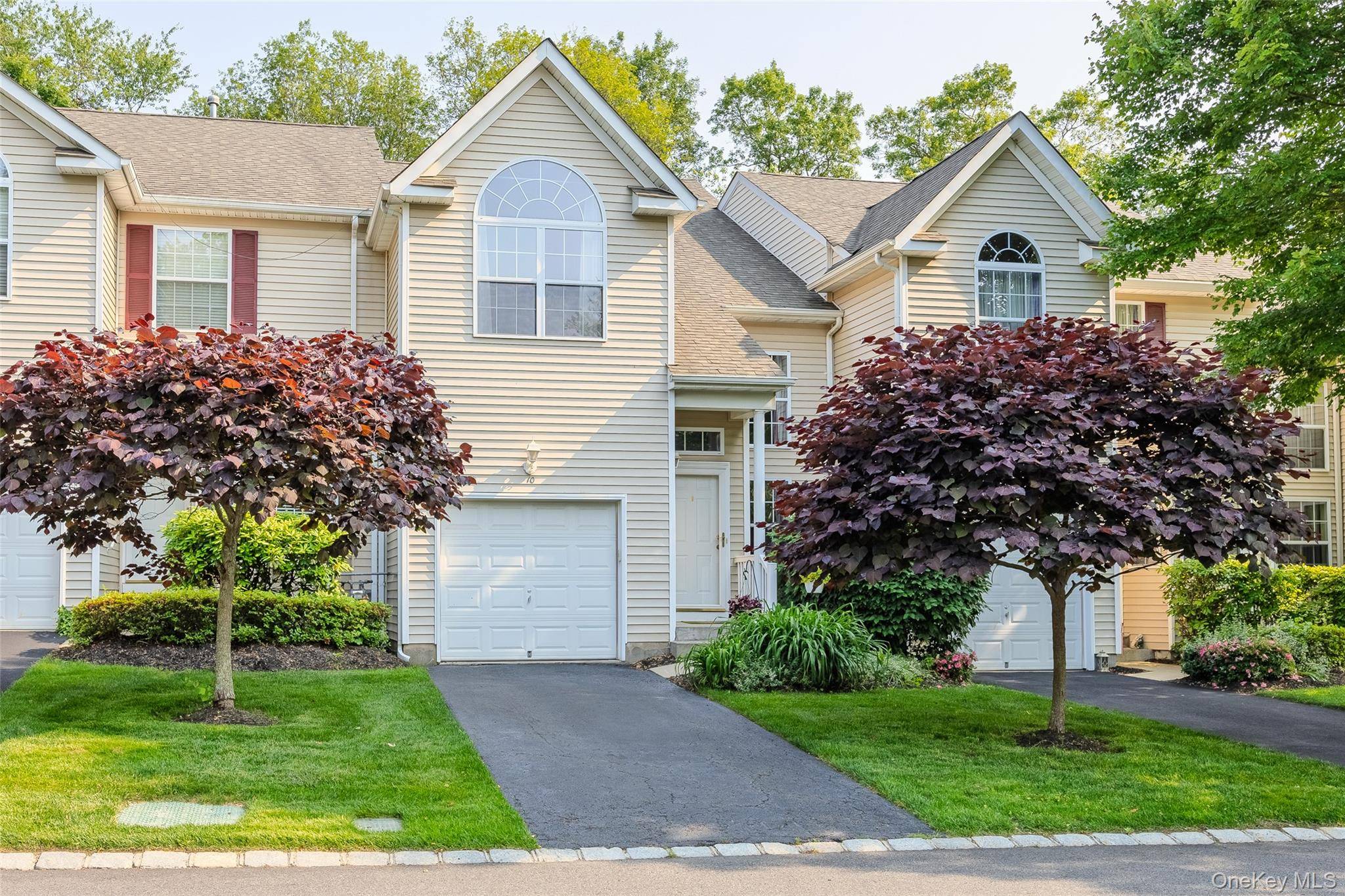 Discover refined living in this gorgeous condo featuring a gourmet kitchen with gleaming black granite countertops, stainless steel appliances, and warm wood cabinetry.