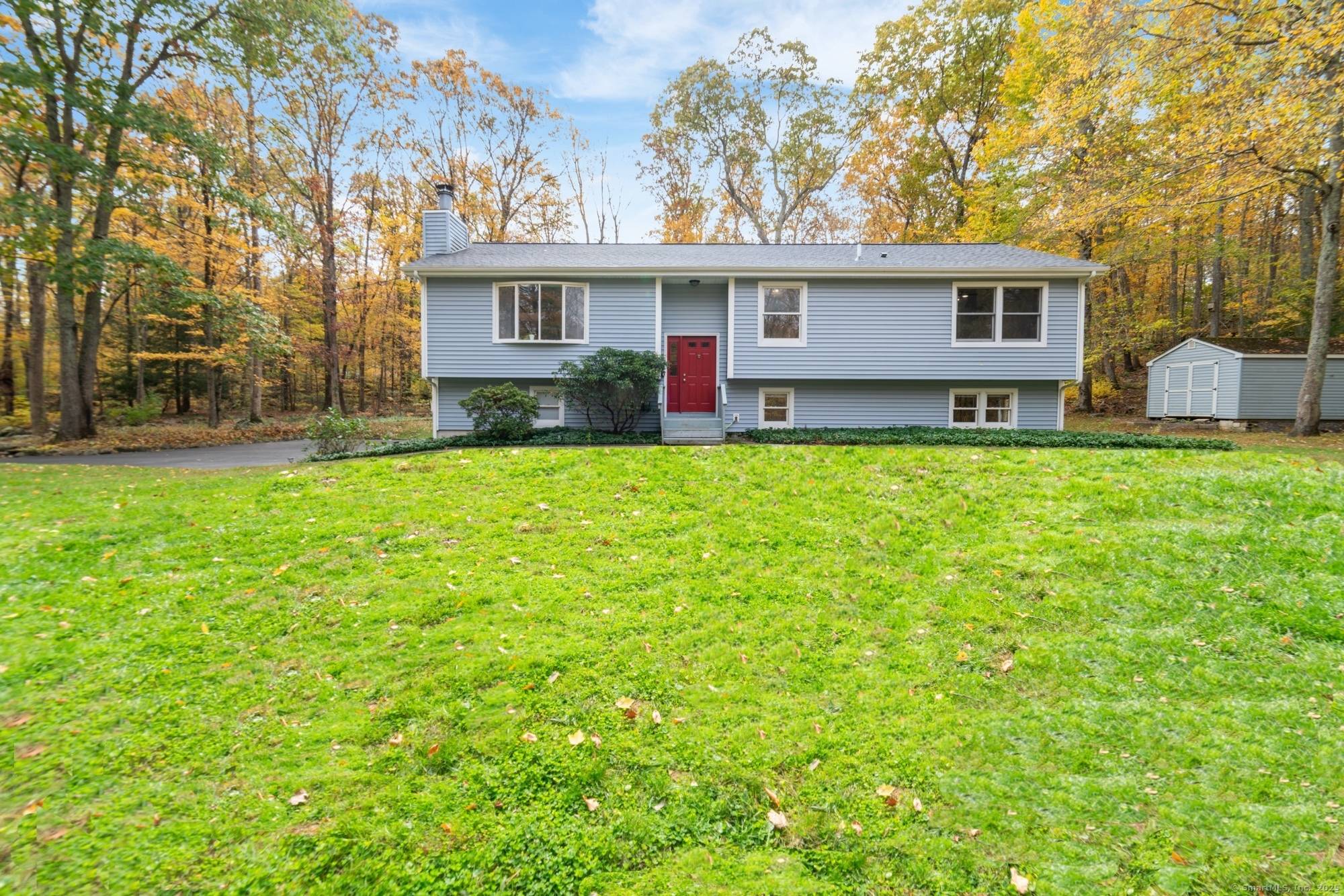 COMPLETELY REMODELED OVERSIZED RAISED RANCH on nearly 4 PRIVATE ACRES in Southbury the perfect blend of modern comfort and peaceful country living.