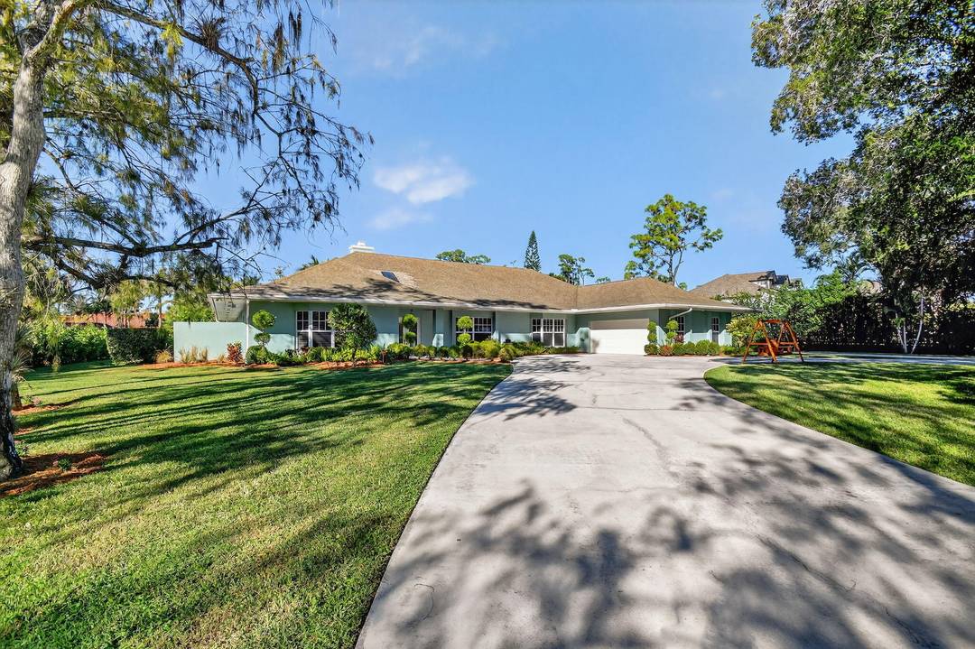 Discover your own private paradise in this beautifully renovated 5 bedroom, 4 bathroom home, complete with a versatile flex room, set on a full acre of lush, tropical land.