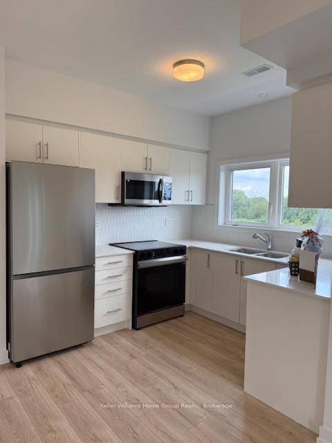 Be the first to live in this brand new 2 bedroom, 2 bathroom stacked townhouse condo, offering two floors of bright, modern living.