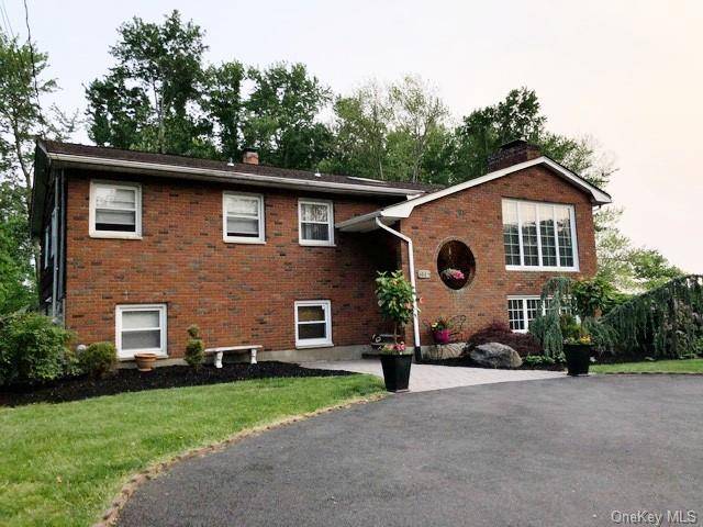 This exceptional residence is ideally suited for multi generational living and is discreetly nestled on a tranquil side street, boasting impressive curb appeal in the sought after community of Clarkstown.