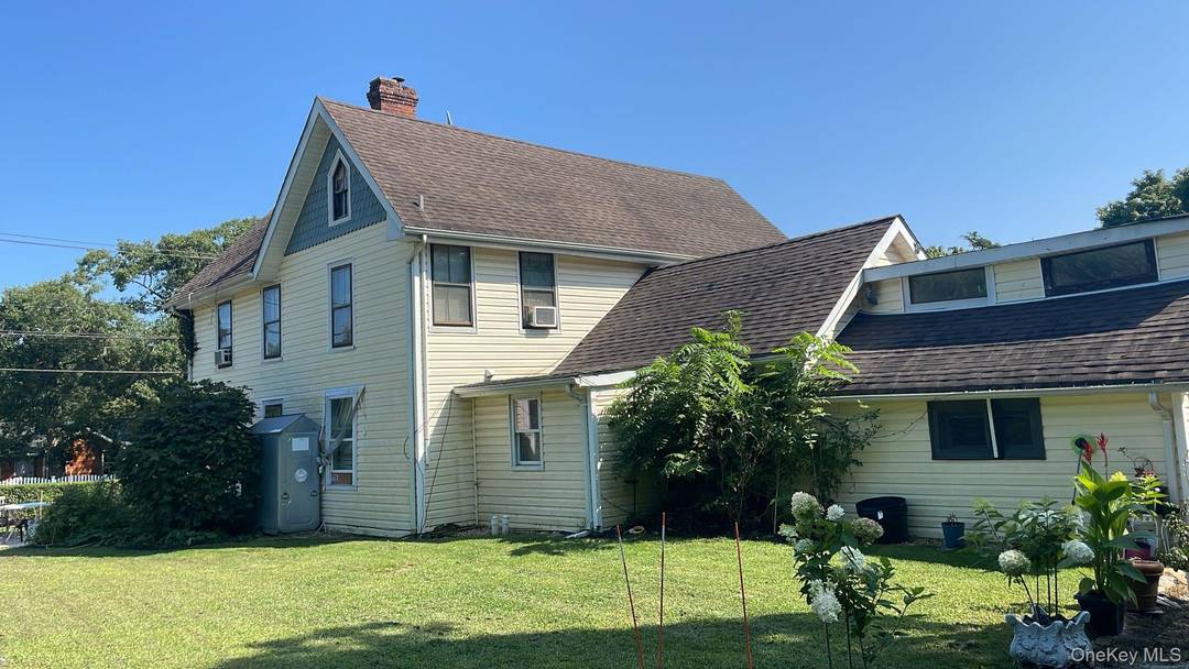 PRIME LEGAL MULTI FAMILY INVESTMENT PROPERTY DEVELOPMENT POTENTIAL An exceptional opportunity to acquire a legal three unit multi family property ideally positioned in the vibrant core of Hampton Bays.