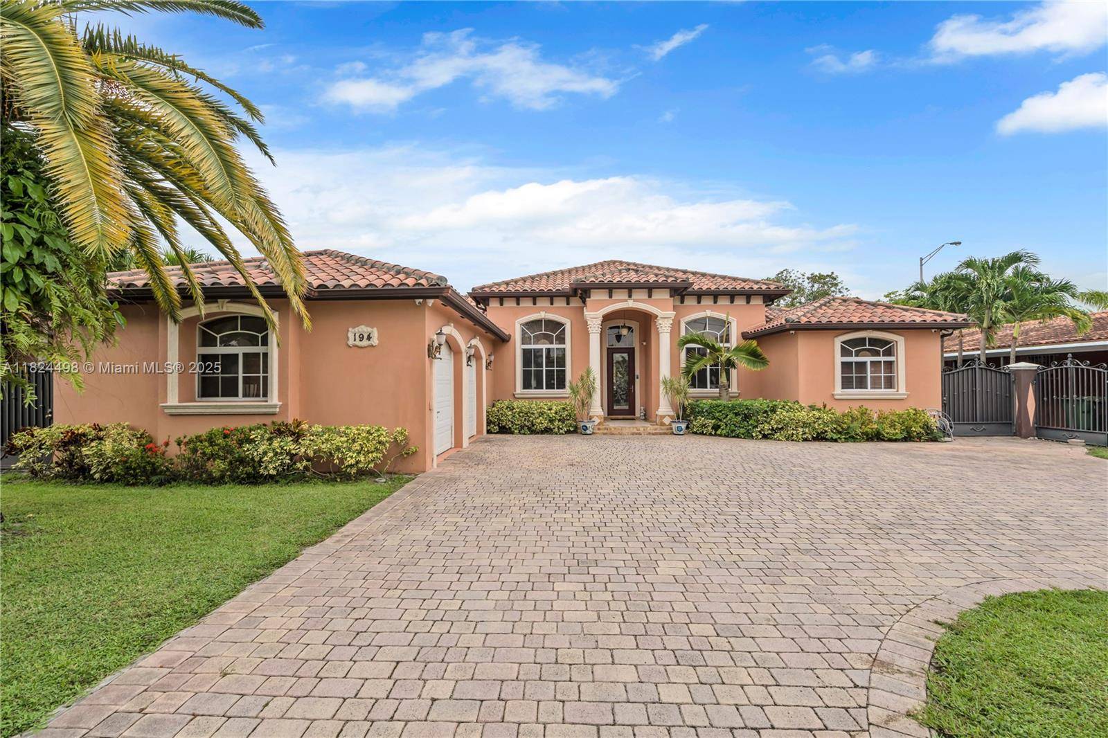 This estate boasts a luxurious pool and a terrace adorned with keystone columns perfect for both relaxation and entertaining.