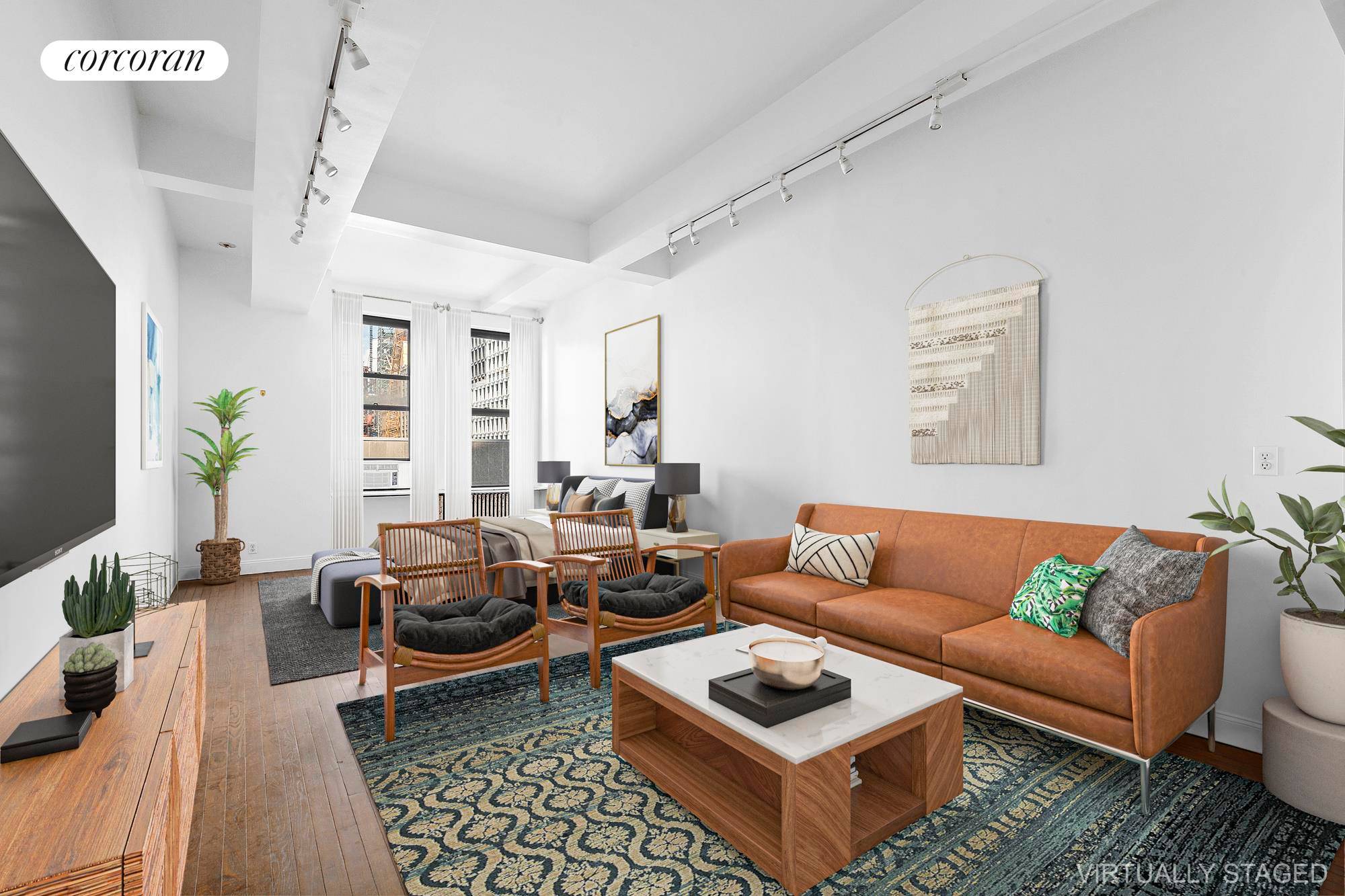 Spacious, west facing studio with 11 foot beamed ceilings directly across from FIT.