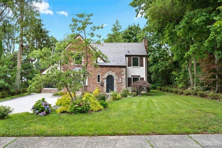 Welcome to this beautifully renovated Tudor, ideally located in one of the most desirable neighborhoods in the Village of Great Neck.