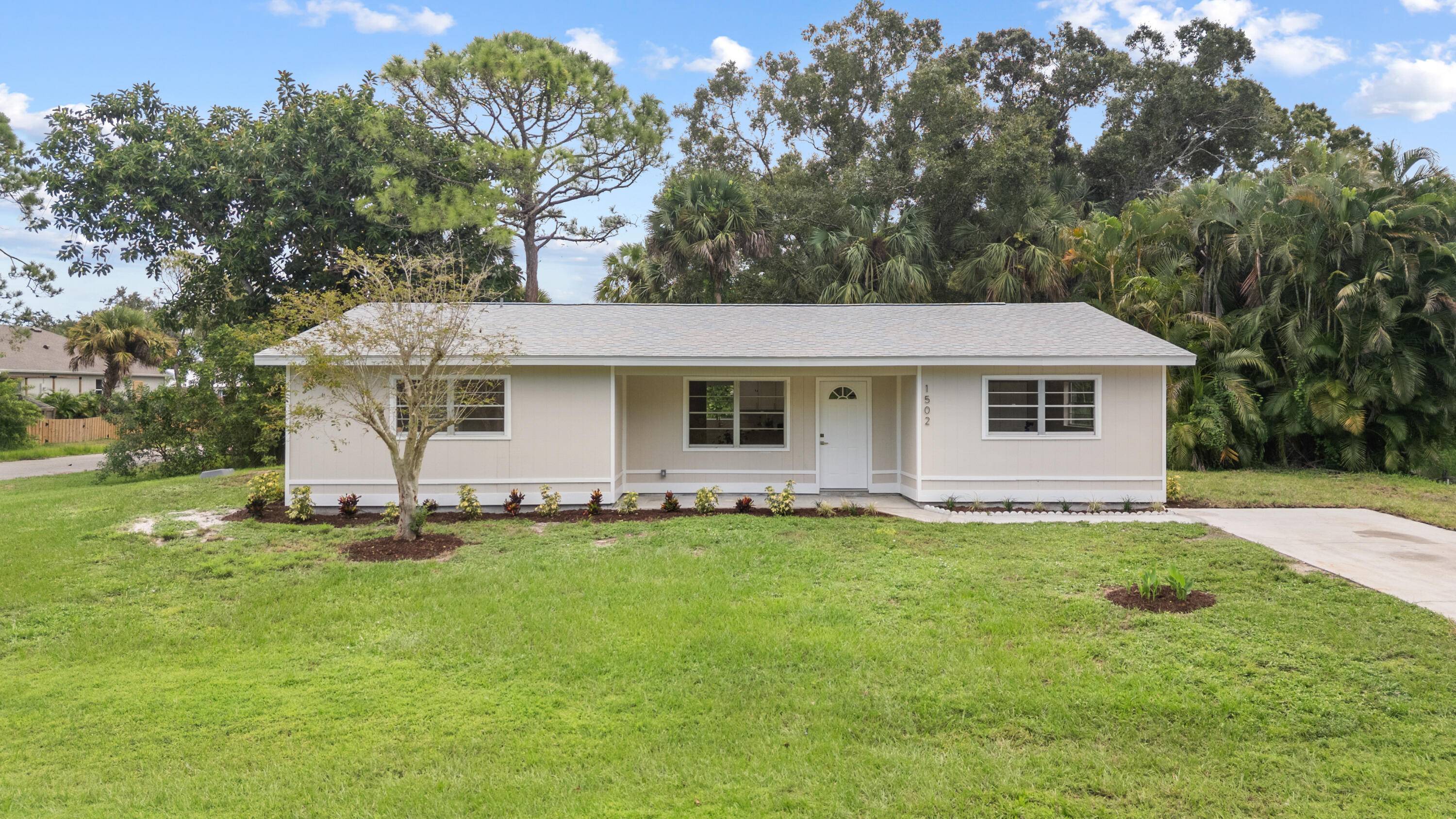 Welcome to this newly renovated home that sits on a large private corner lot in a quiet neighborhood.