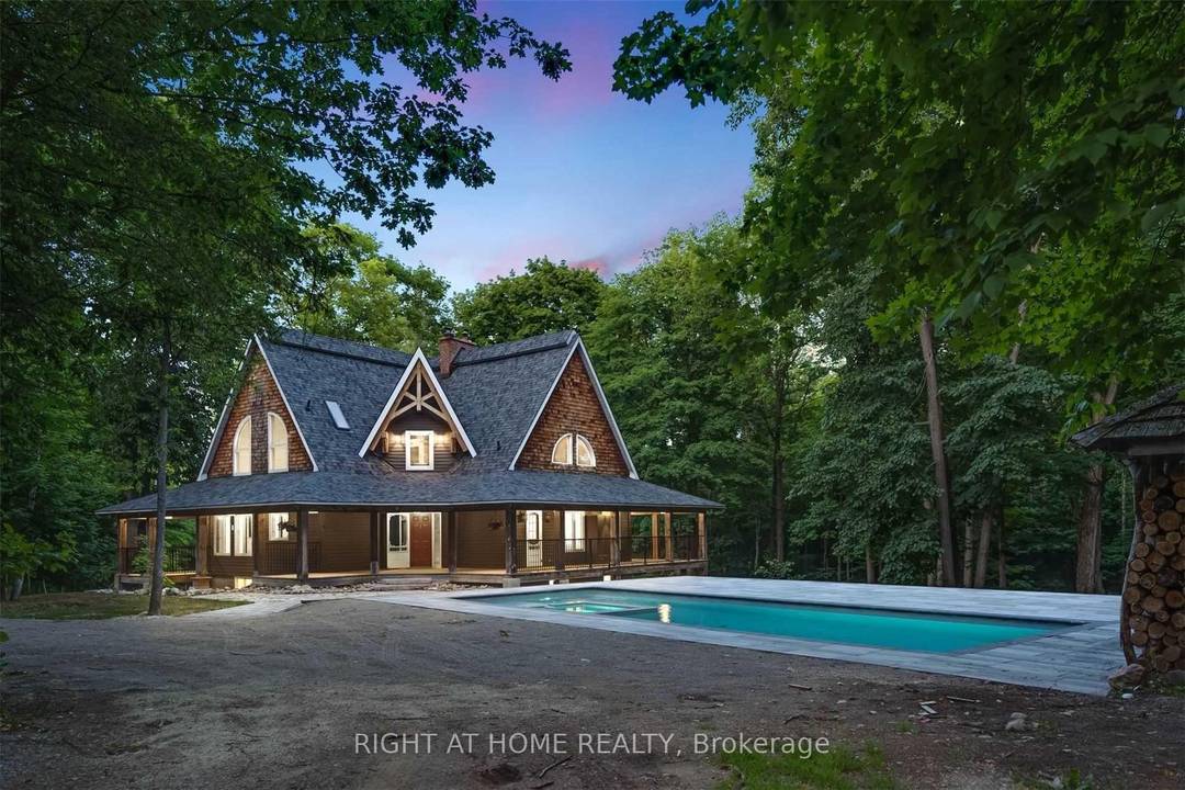Welcome to this secluded custom Timberframe retreat, set on nearly 100 acres of pristine land surrounded by mature trees, farmland, and a tranquil pond.