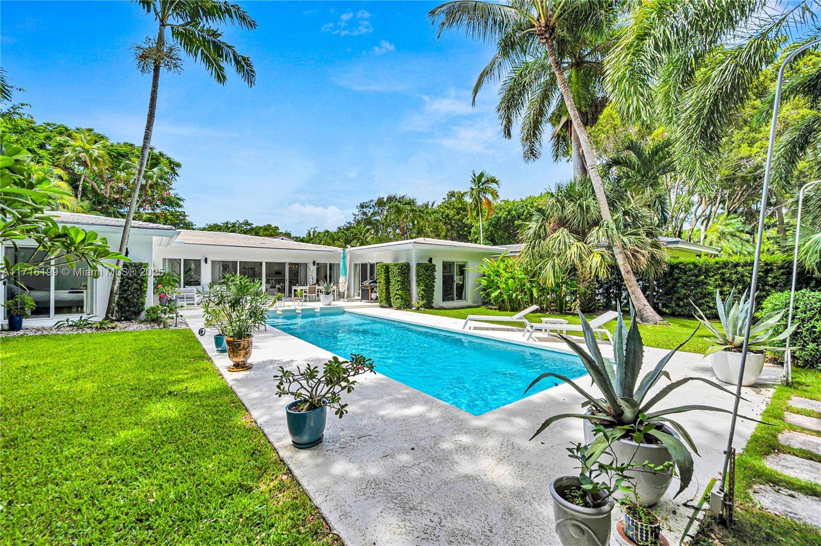 Welcome to this mid century tropical oasis on a large 12k sf lot in one of Miami's most desirable neighborhoods.