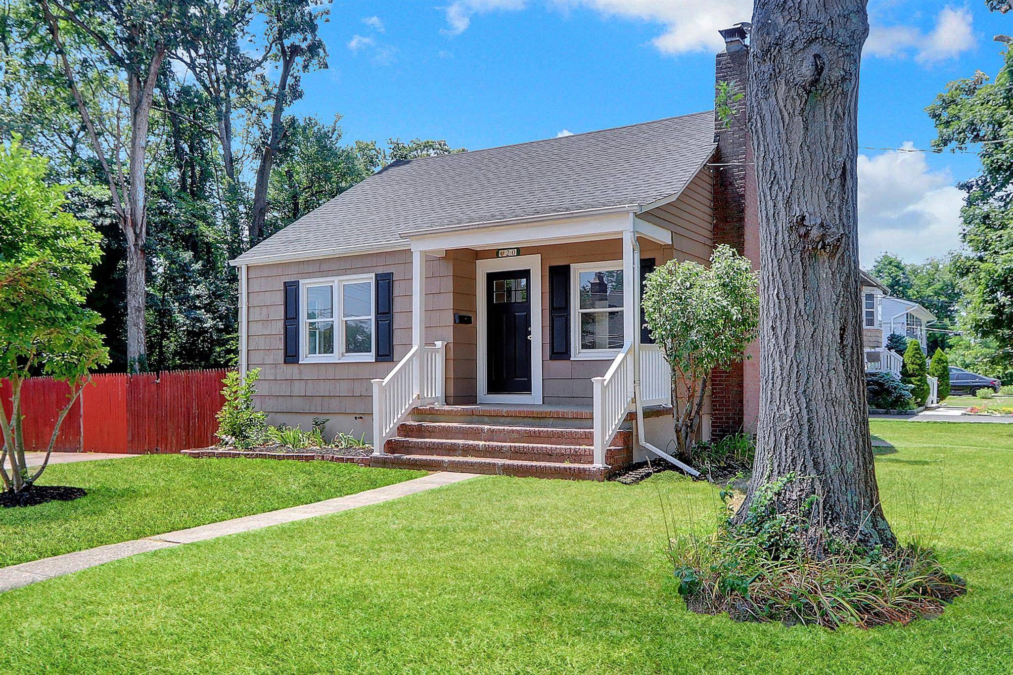 Fantastically updated Cape Cod style with redone floors, freshly painted, gorgeous kitchen and beautifully updated bathrooms, having exceptional charm combined with improvements for modern living.
