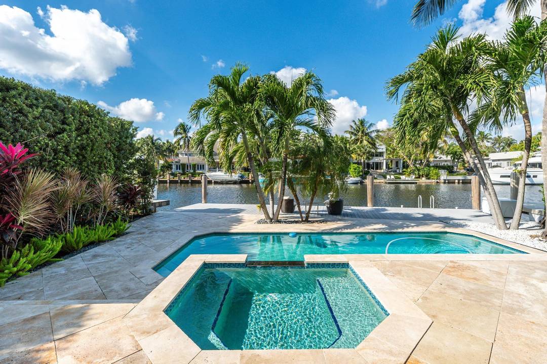 Exquisite modern home on 55 ft of private waterfront, steps from Las Olas Blvd and the beach.