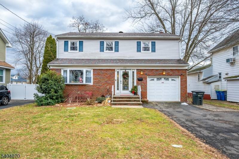This spacious four bedroom, two and a half bath Colonial is bright and sunny, featuring generously sized rooms that radiate warmth and timeless charm.