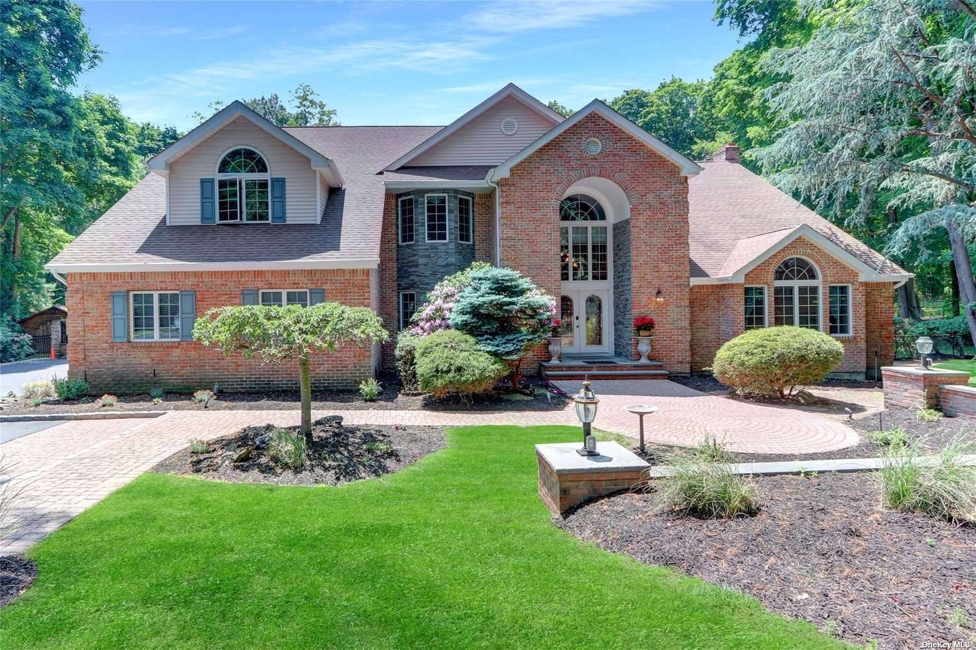 The 2. 2 acre setting is complemented by beautiful landscaping and an in ground pool ; that is perfect for entertaining.