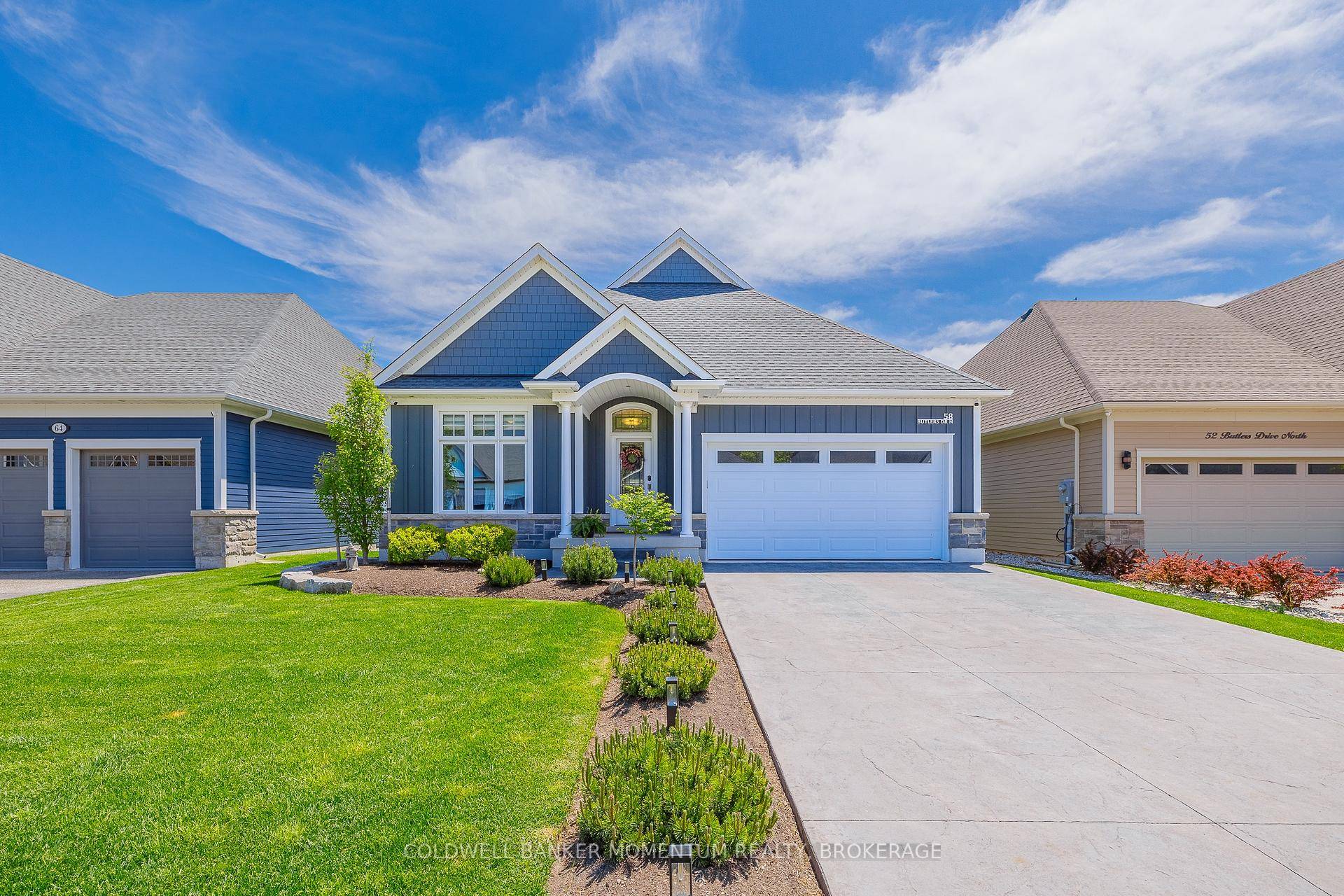 Welcome to 58 Butlers Drive North a beautifully crafted custom bungalow nestled in the exclusive community of The Oaks at Six Mile Creek in Ridgeway.