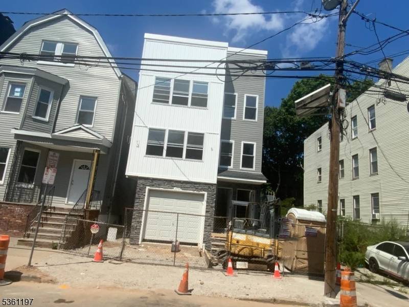 Brand new 2 fam home to be build according to plans 1st fl garage, utility room, rec room, with half bath connection to apartment 1 with 3 bedrooms living dining ...