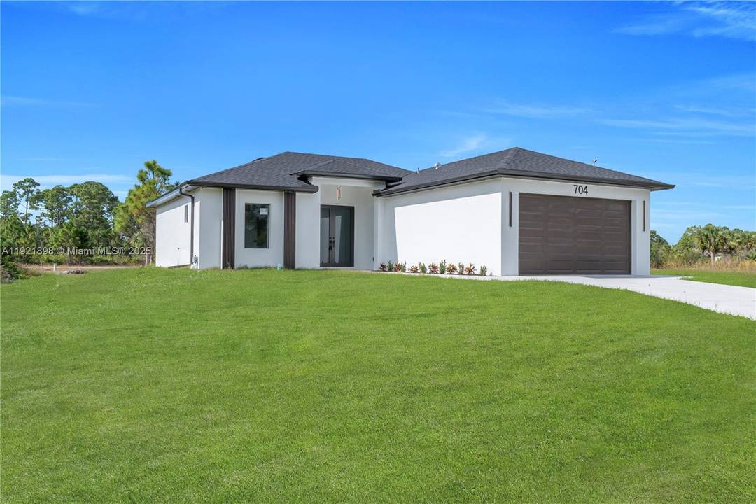 Stunning brand new 3 bedroom, 2 bathroom home featuring modern tile flooring throughout, upgraded lighting, and a sleek contemporary kitchen.