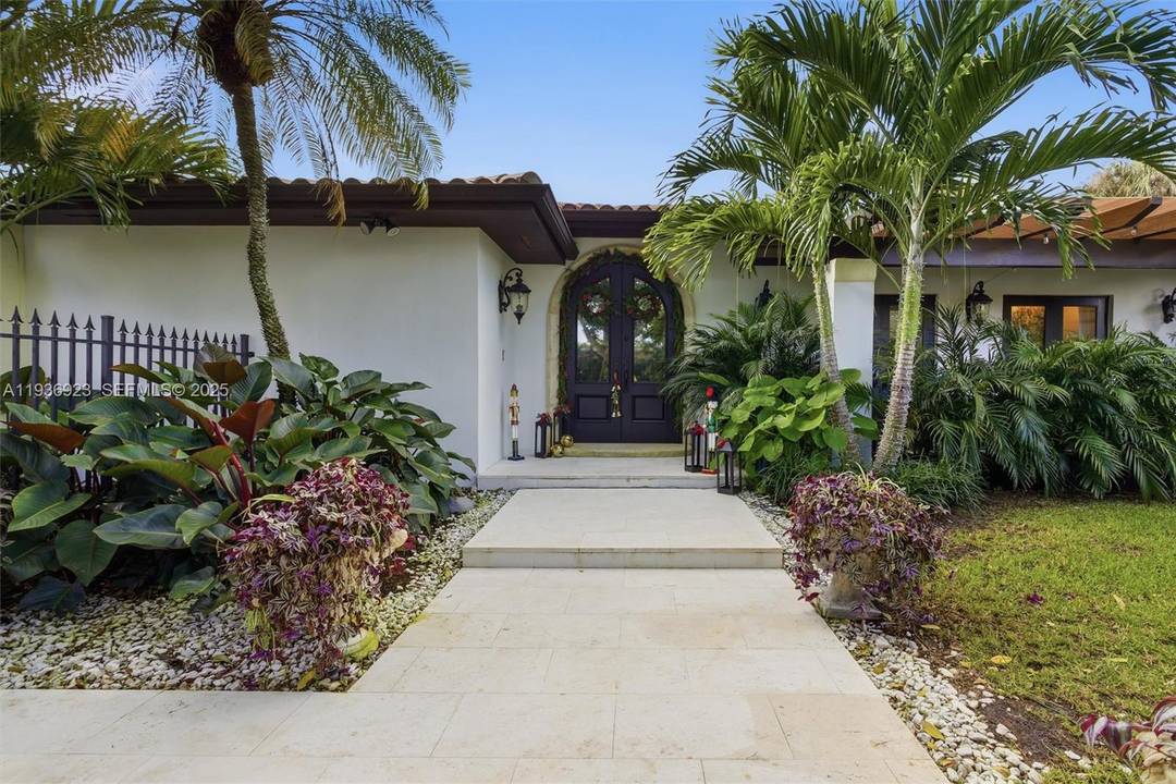 Nestled at the end of a quiet cul de sac in the exclusive gated community of Gables by the Sea, this 6 bedroom, 3.