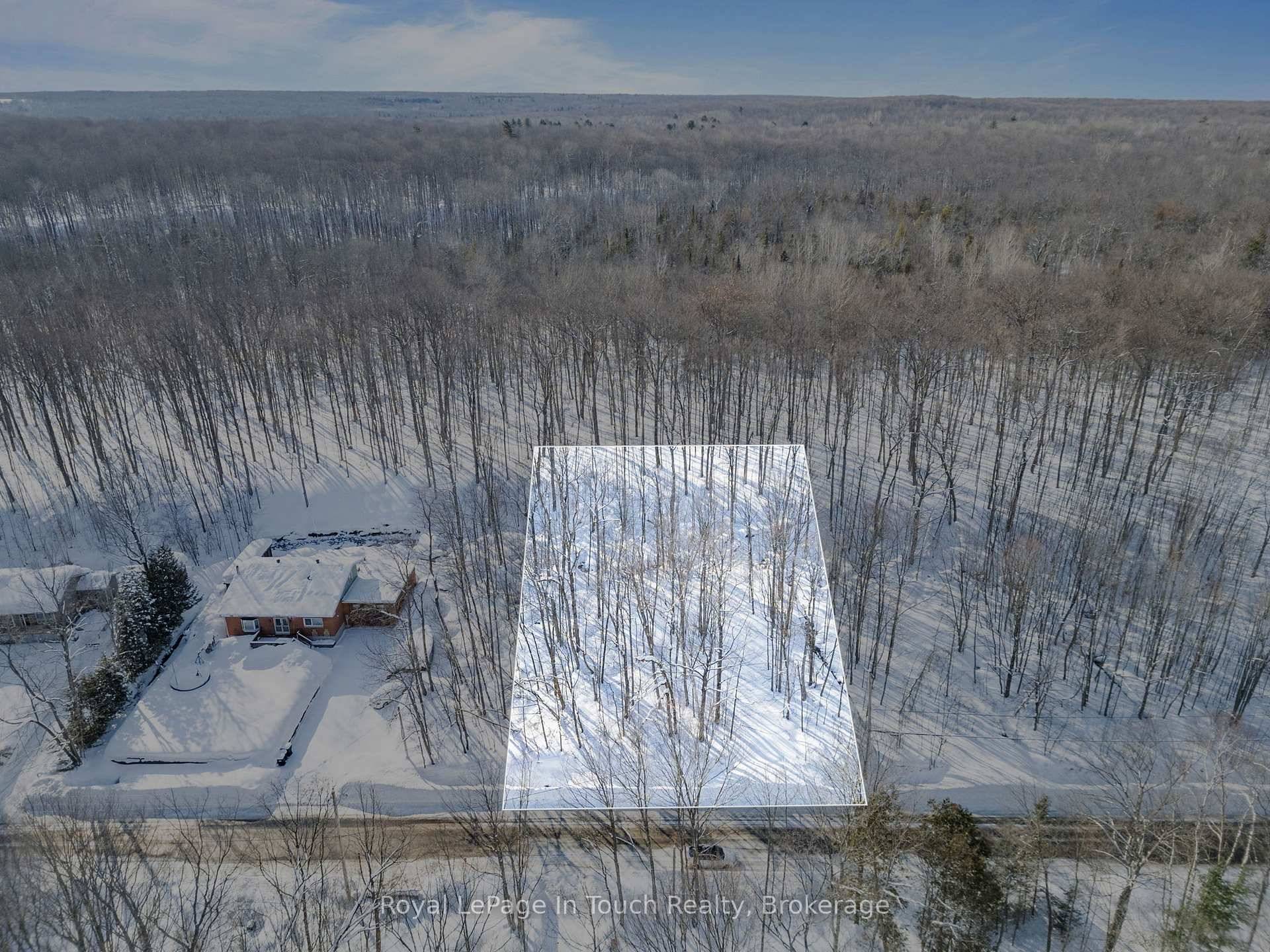 Treed vacant lot for sale in the beautiful area of Clearwater Beach, Tiny located directly across from the water access to Georgian Bay set amongst permanent and seasonal dwellers.